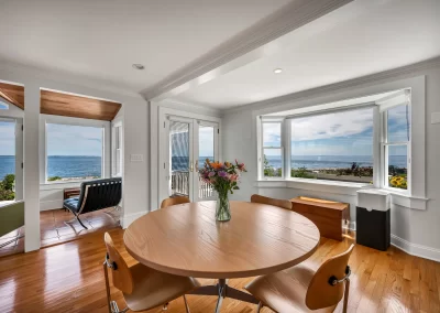 Professional real estate photo of dining area with water view on Connecticut shoreline