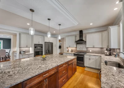 lots of space to spread out in this kitchen with beautiful granite island and countertop. Real Estate photography. West Hartford, CT